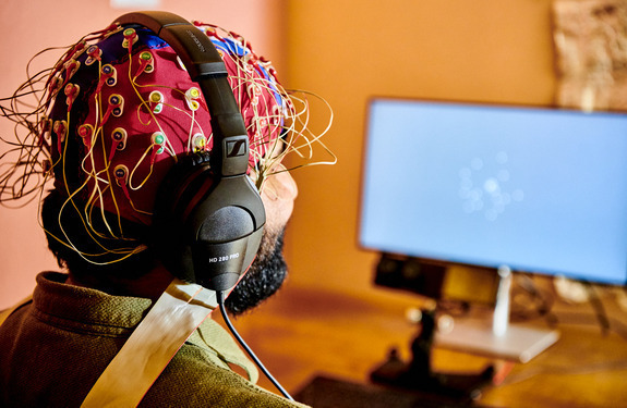 Someone on computer with headset on